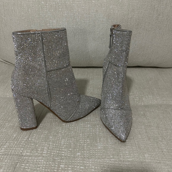Steve Madden, Silver Sequin Booties
size 6.5
Worn once - Picture 3 of 3
